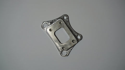Revive Motorsports T25 turbo adapter, flat front view with RM engraving